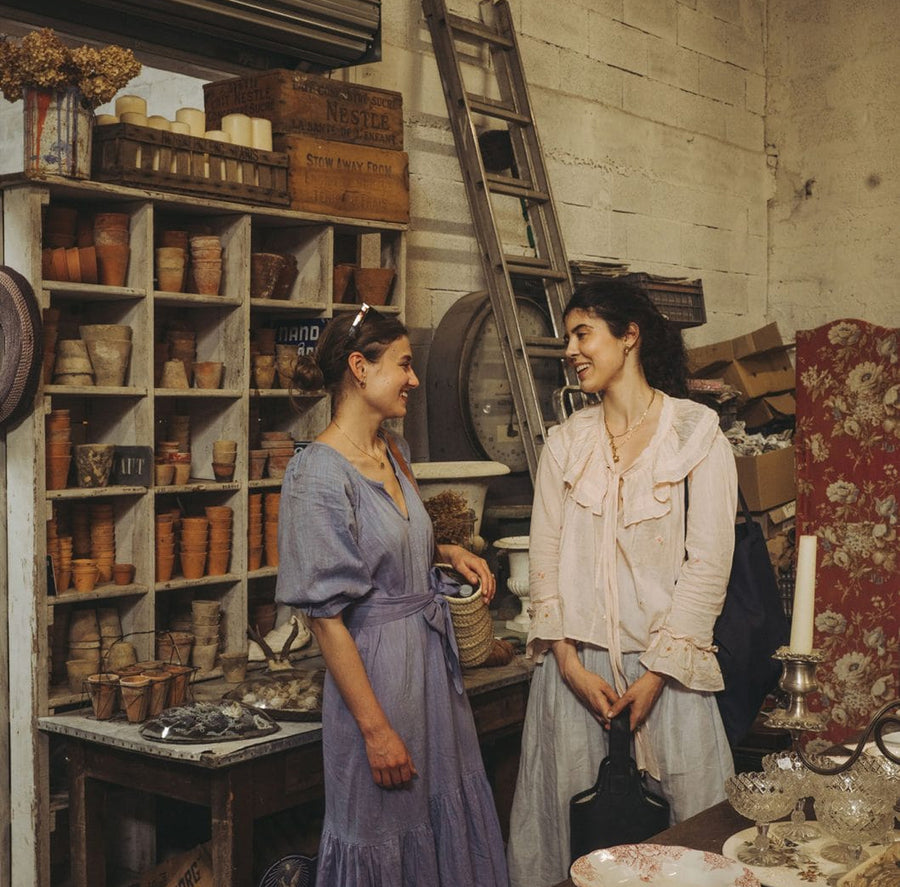 Friends conversing in rustic studio