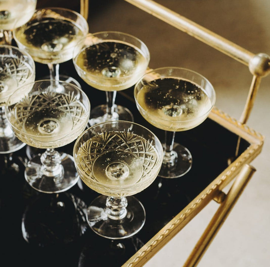 Sparkling champagne coupes toast