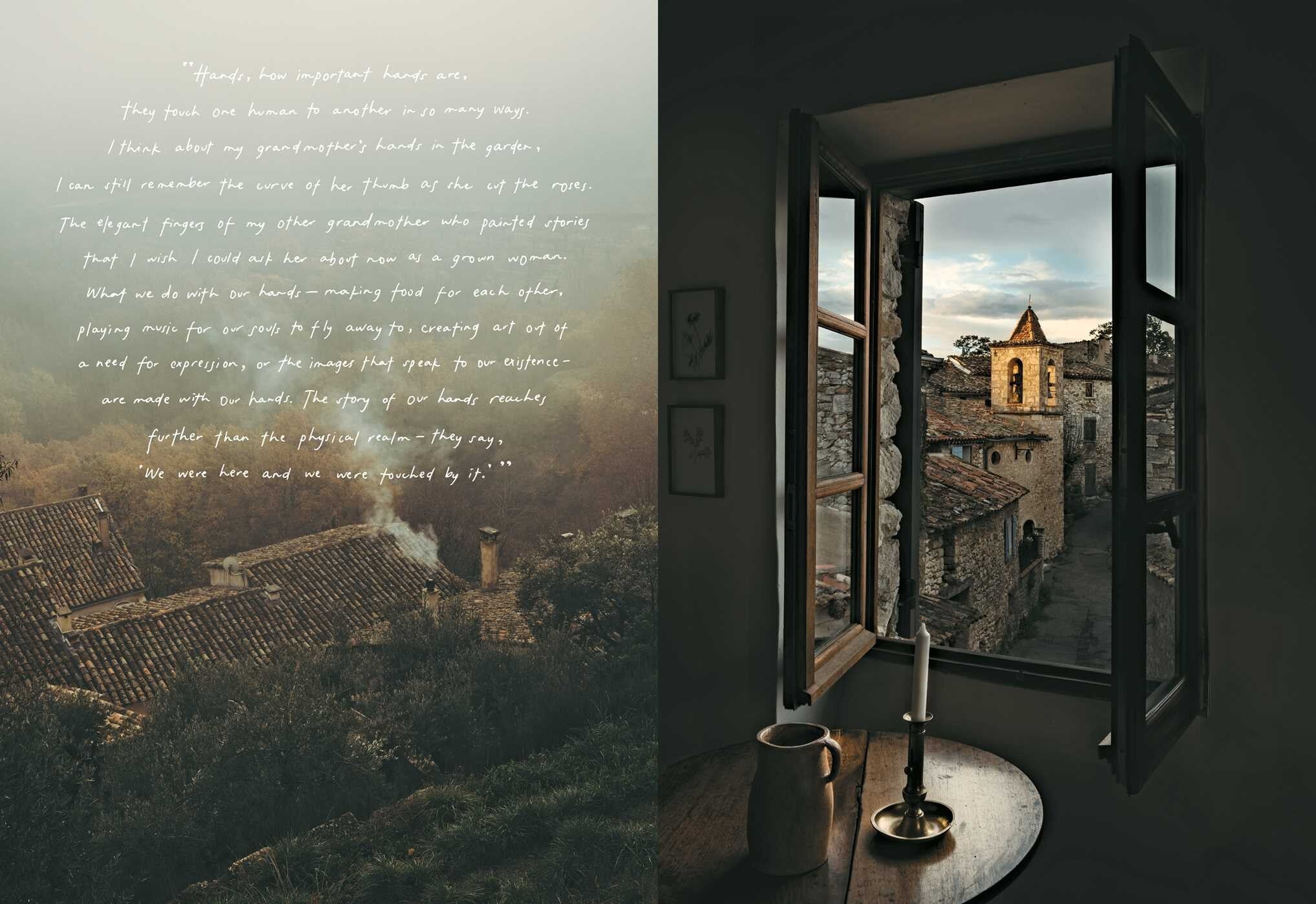 Open window overlooking historic stone village