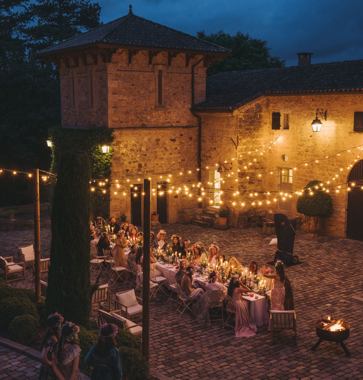 Retreat guests gathered on stone chateau courtyard